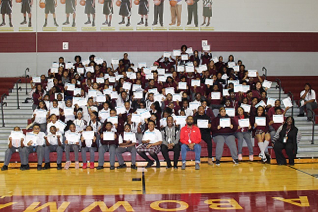 TBLA honor scholars posing in the gym  